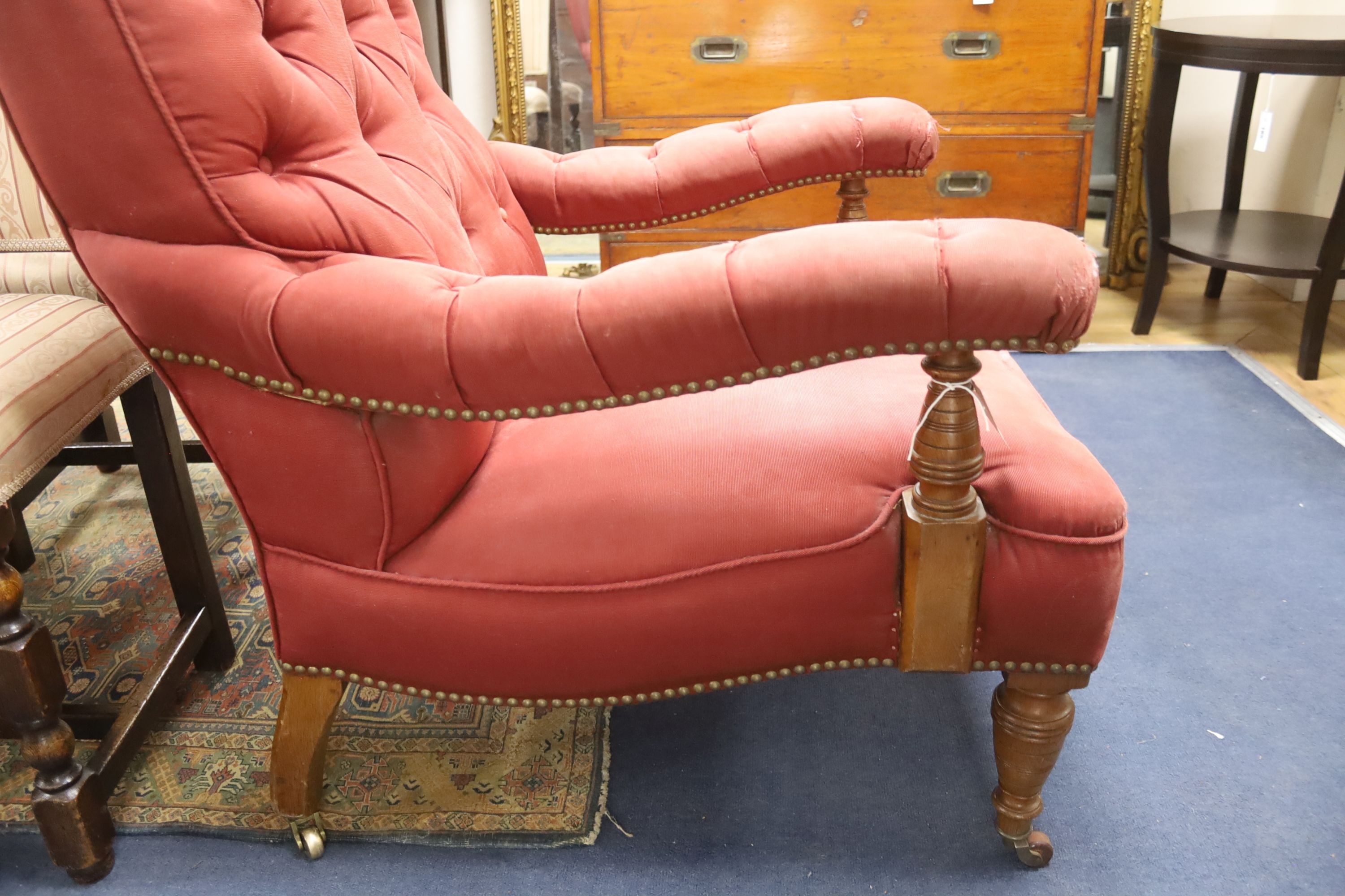 A Victorian oak upholstered open armchair, width 74cm, depth 84cm, height 98cm